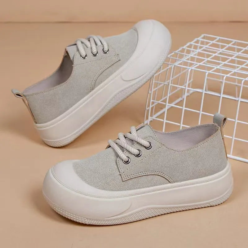 Women's beige suede platform loafers with a lace-up front and 4cm thick sole.