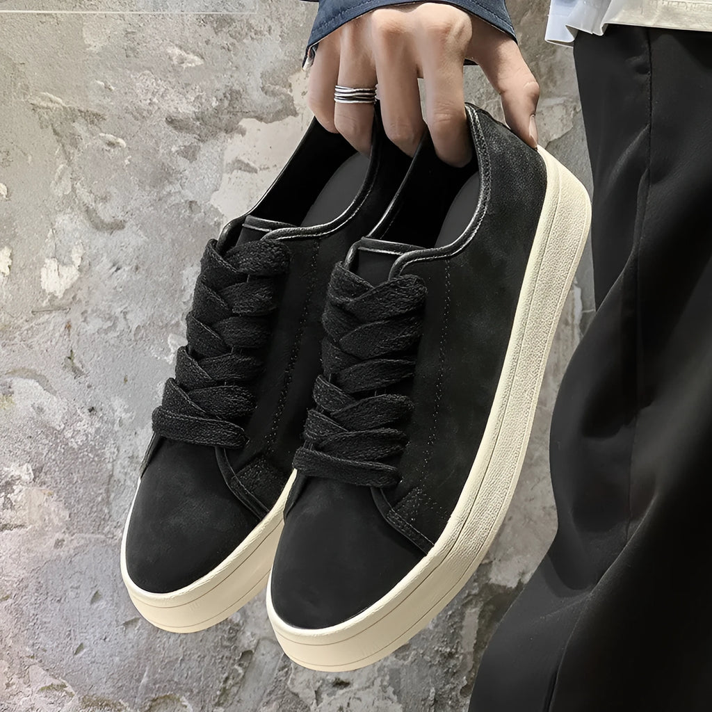 Breathable matte leather sports casual shoes in black with stitched detailing, low-top profile, and rubber sole