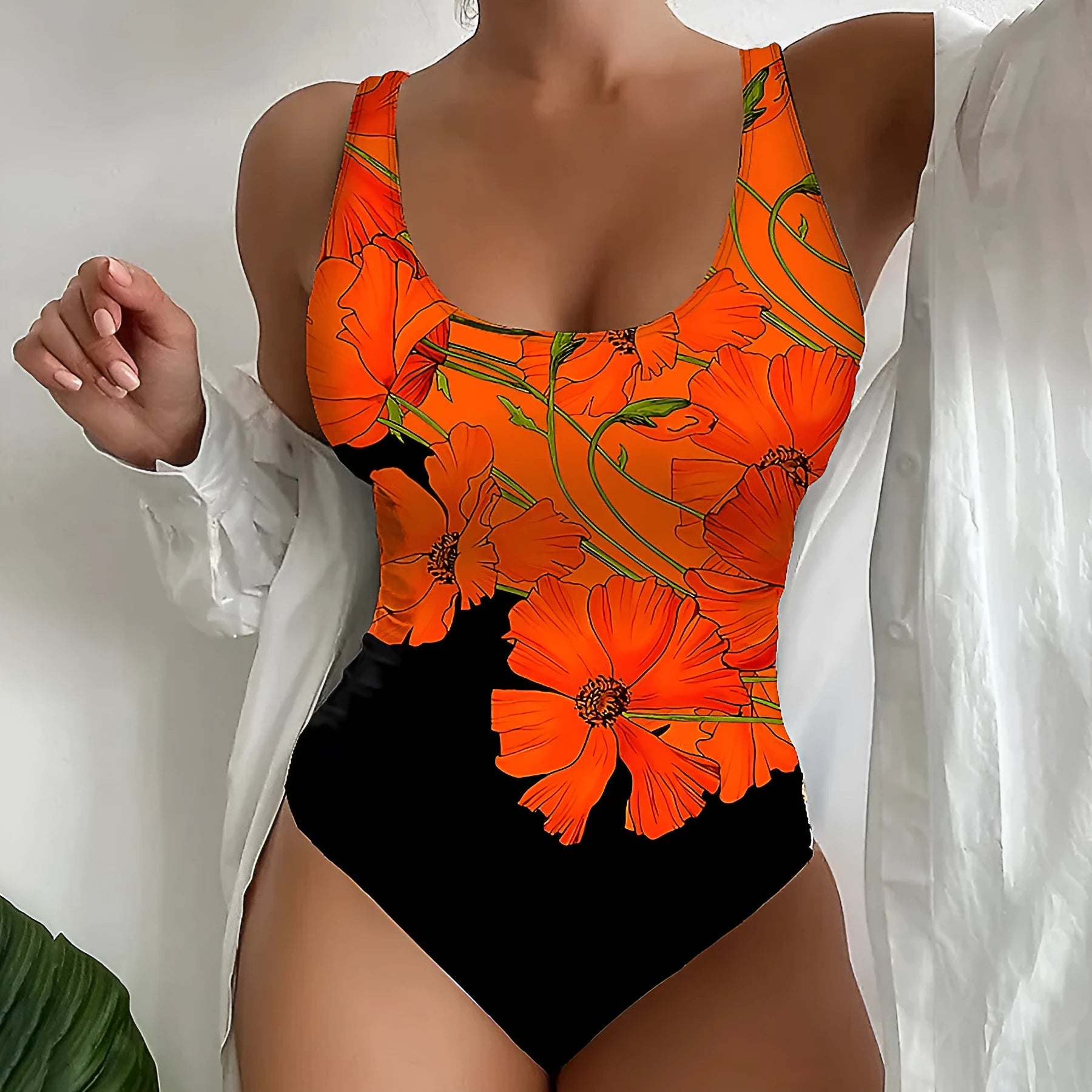 Orange floral print backless one-piece swimsuit on a hanger, showing slim fit design.