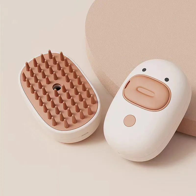 White and yellow pet steam brush with rubber comb teeth and water tank for cats and dogs