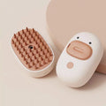 White and yellow pet steam brush with rubber comb teeth and water tank for cats and dogs