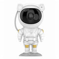 Small astronaut-shaped night light projecting starry laser atmosphere with white light, PVC shade, USB powered
