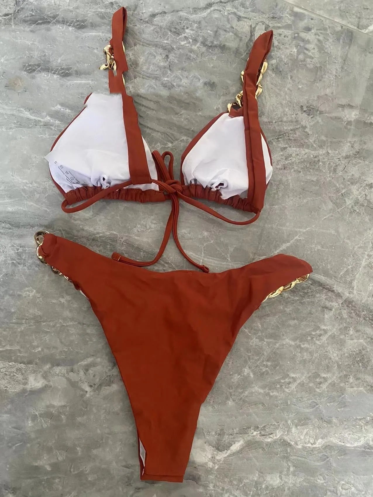 Brown women's tube-top bikini with adjustable ring straps and a split skirt for swimming.
