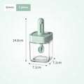 Yellow retractable glass seasoning jar with lid in Nordic style on kitchen counter