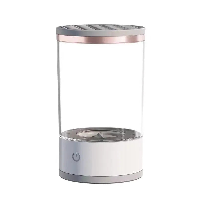 Electric makeup brush cleaner in grey and white with brush inserted, 17x9x9 cm, USB charging