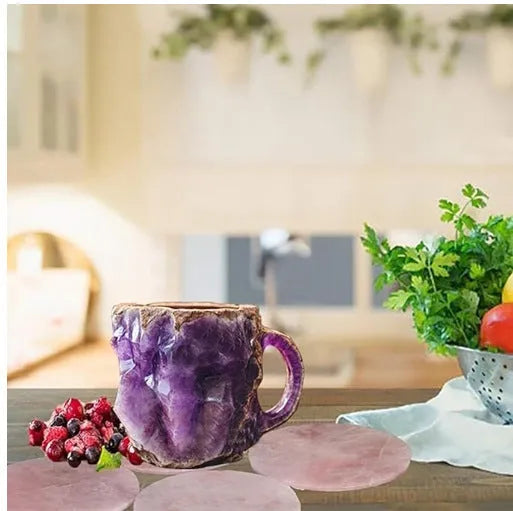 A purple resin coffee mug with a handle, showing a crystal-like structure, on a table.