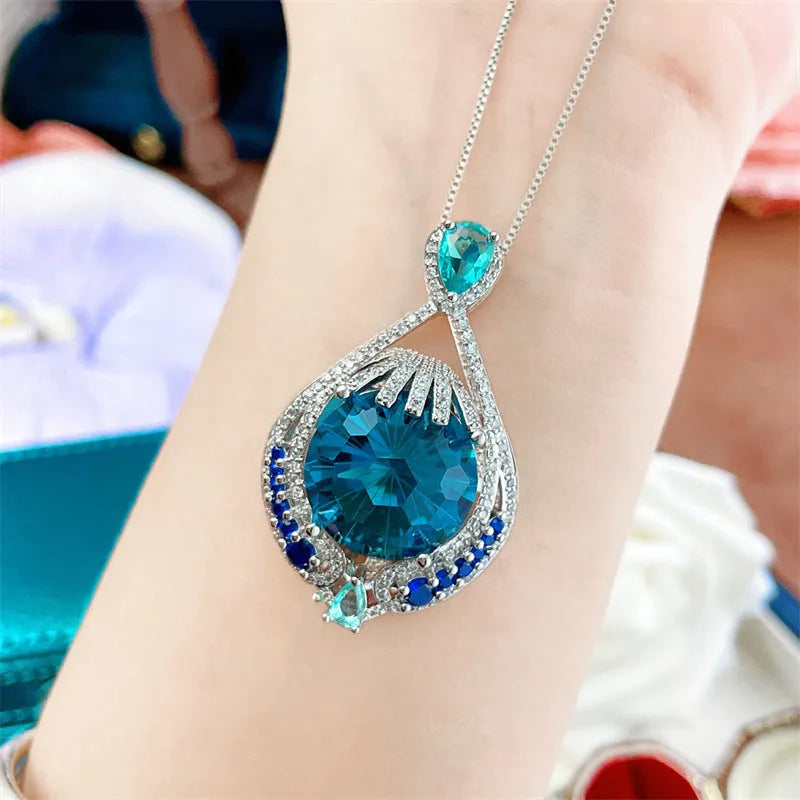 Women's blue crystal geometric necklace with fireworks-cut pendant on water wave chain
