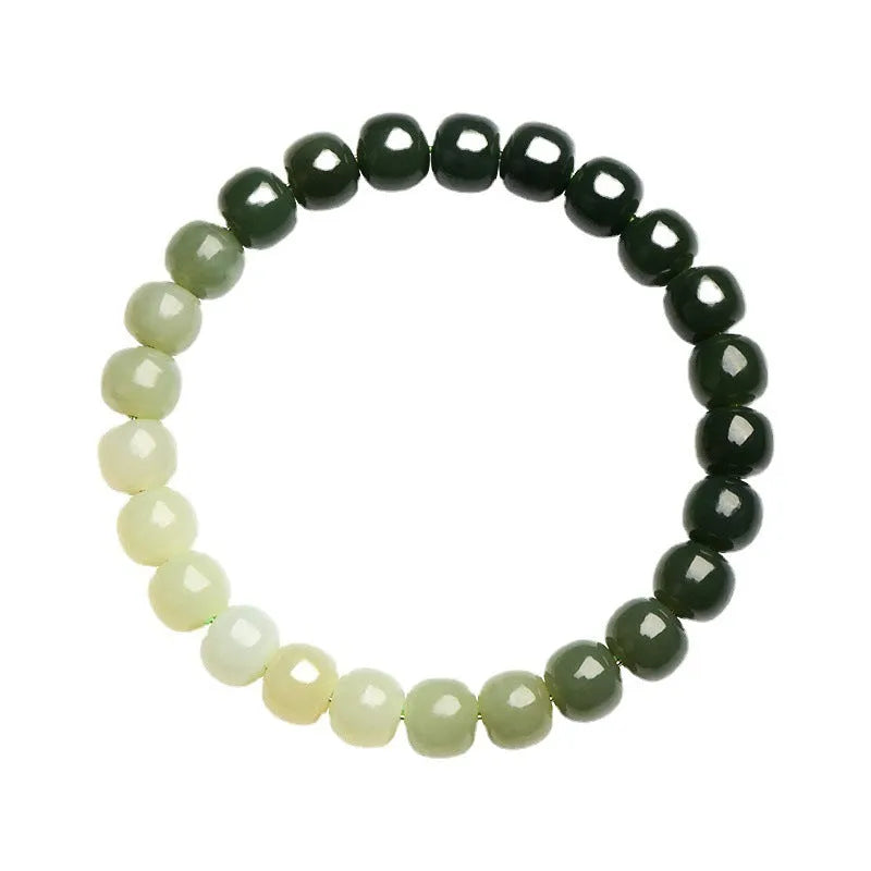 Natural Hetian jade bracelet with gradient clear water colours on wrist.