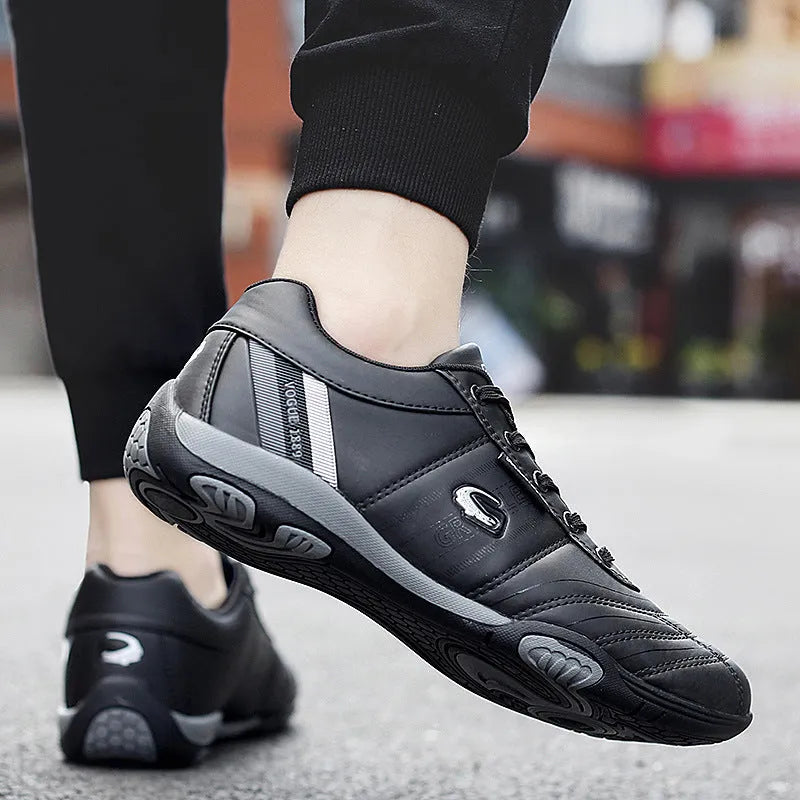 Men's casual sneakers with white space leather upper, round toe, and flat heel on a plain background