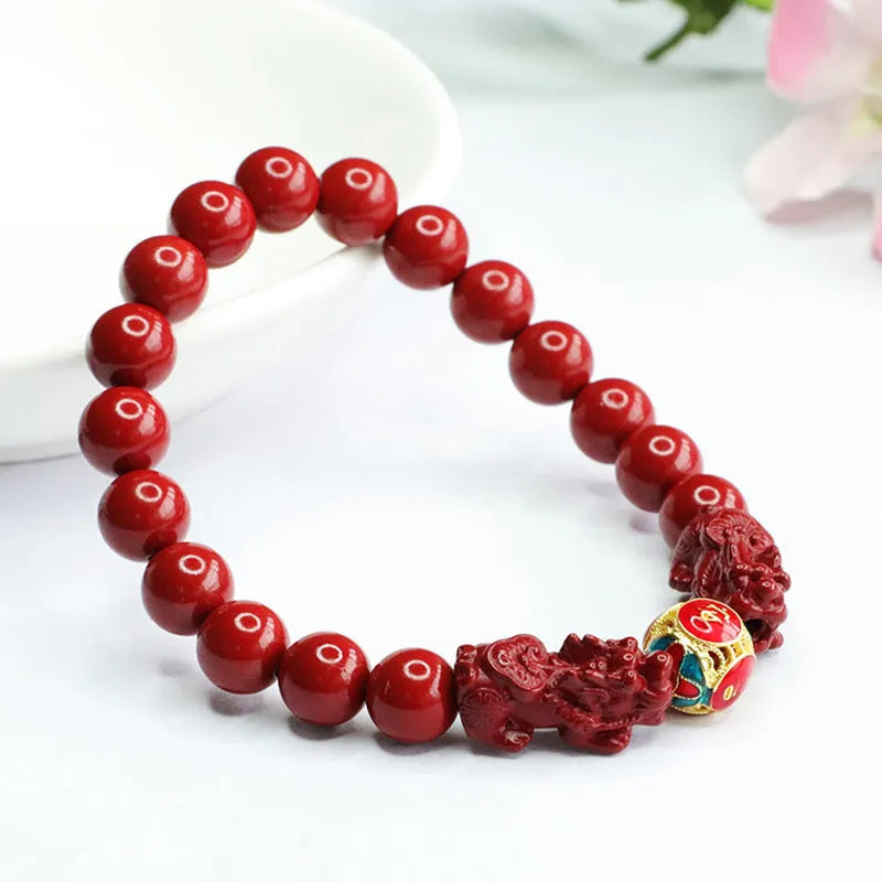 Close-up of a purple gold sand Cinnabar bracelet with carved Double Pixiu design, bead size 8mm.