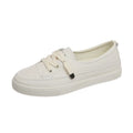 Women's casual lace-up shoes in white with round toe and rubber sole, side view