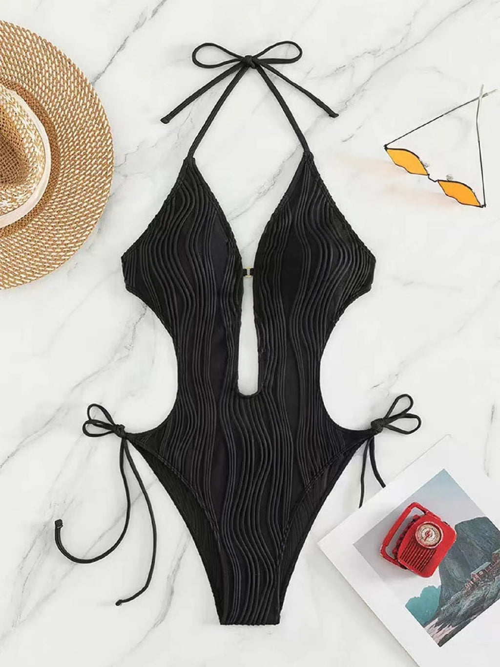 Women's black lace-up triangle bikini swimsuit with adjustable ties and solid colour design