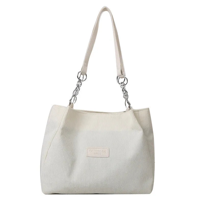 Corduroy women's tote handbag with one-shoulder strap and three-dimensional pocket in horizontal square shape