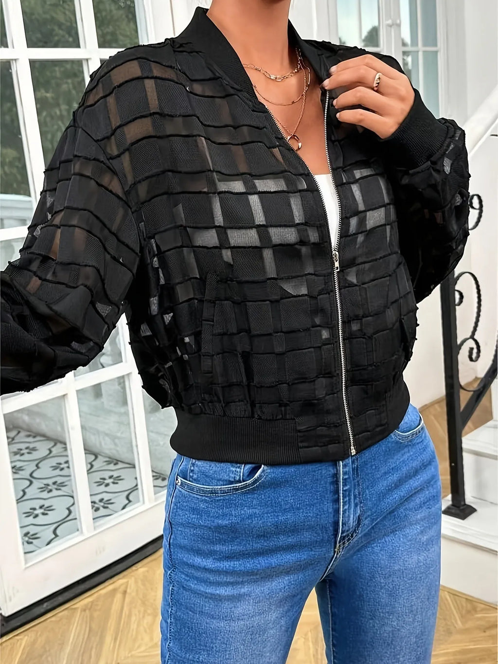 Black women's semi-transparent jacket with geometric pattern and front zipper