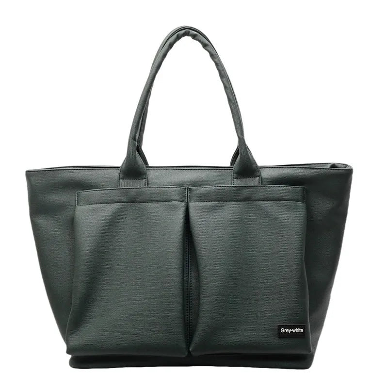 Lightweight PU shoulder bag with expandable 20-35 litre capacity in black, white or green