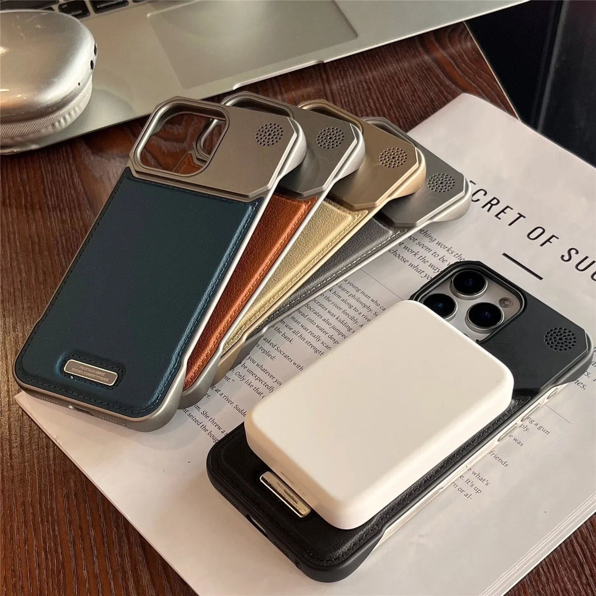 Aromatherapy leather magnetic phone case for iPhone, frameless hard PC cover in Black, Gray, Blue, Brown or Gold.