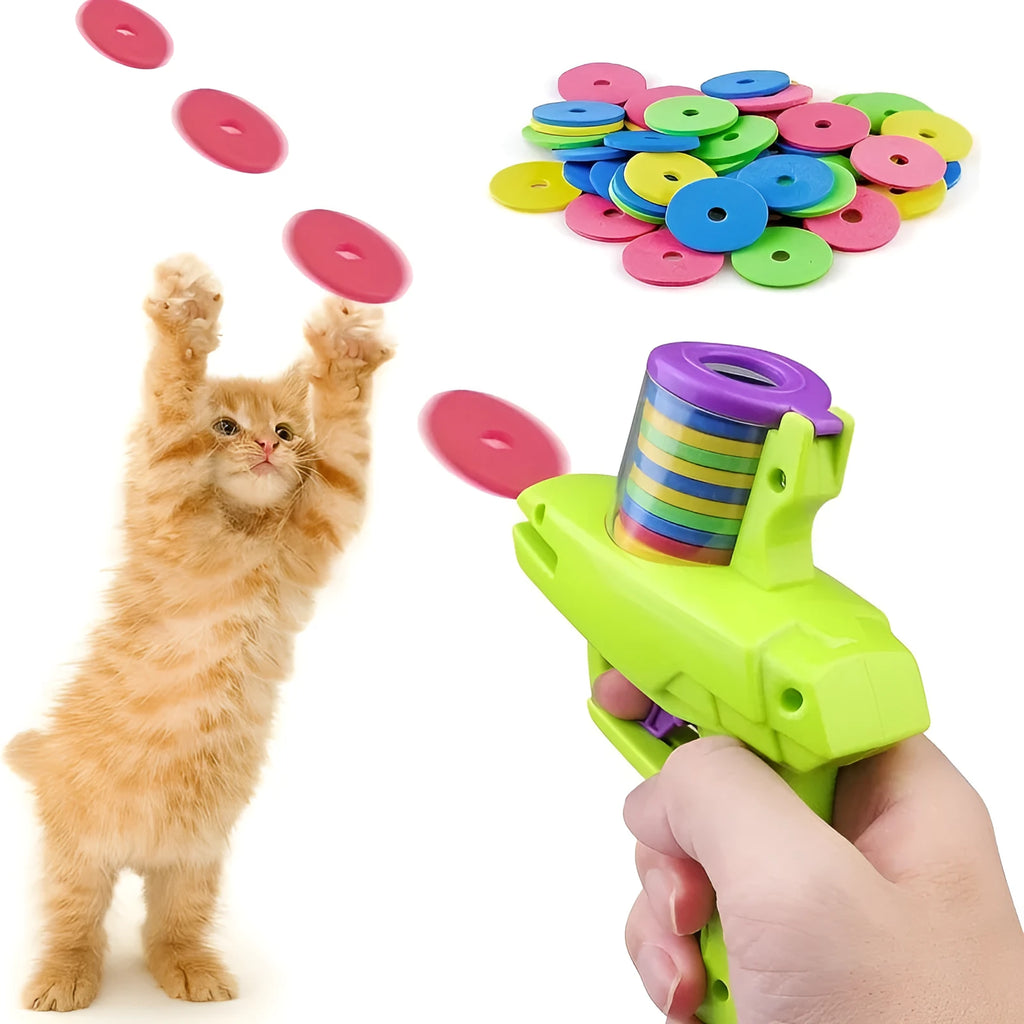Green and purple battery-free interactive cat toy launcher with soft foam discs on a plain background