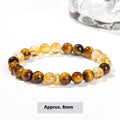Close-up of a women's yellow tiger-eye stone and crystal bracelet with 8mm round beads.