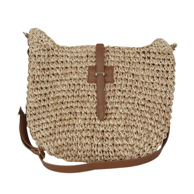 Handmade beige square woven bag with a shoulder strap on a neutral background.