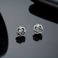 Titanium steel unisex ear studs with geometric star motif and letter detailing, black pair (X935B)
