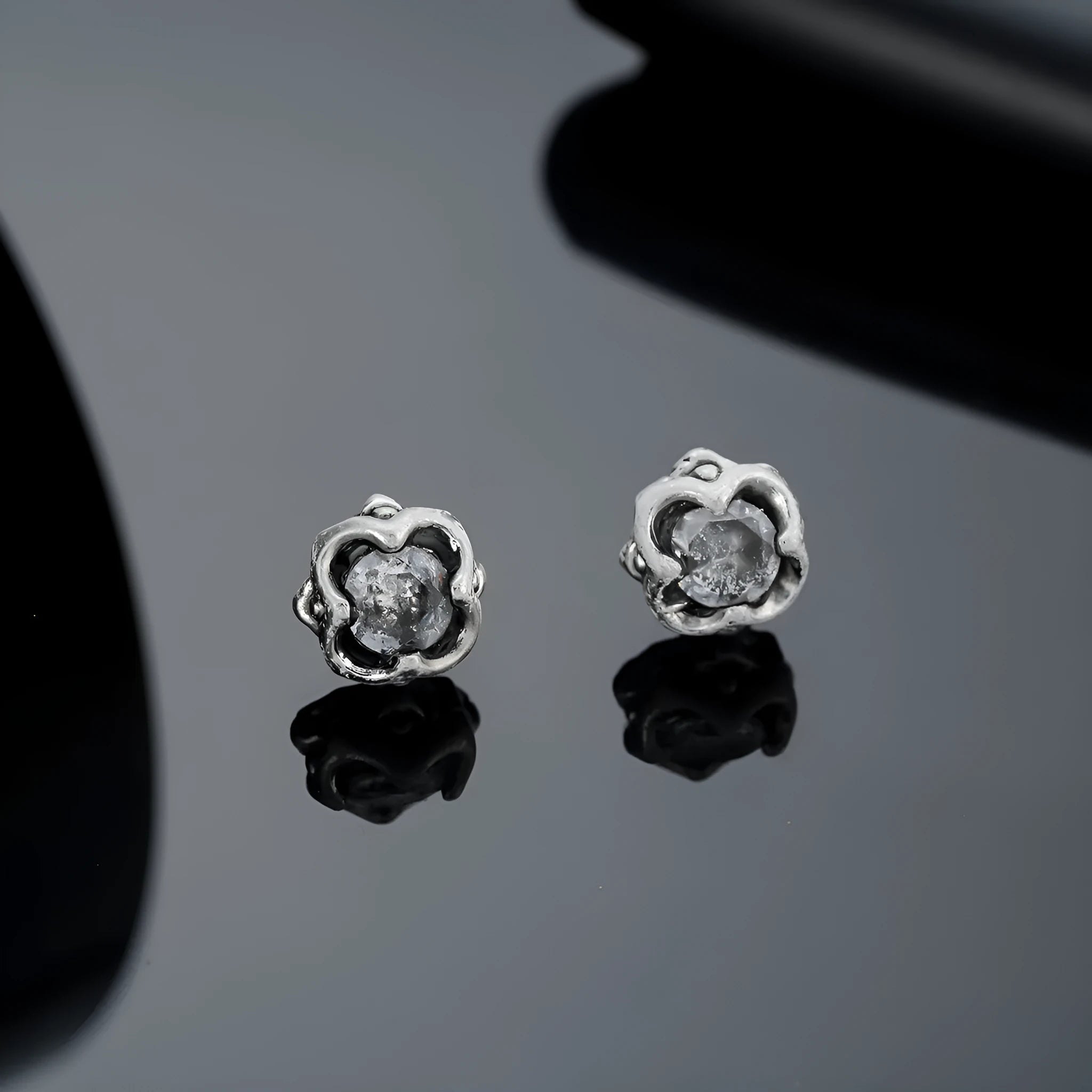 Titanium steel unisex ear studs with geometric star motif and letter detailing, black pair (X935B)