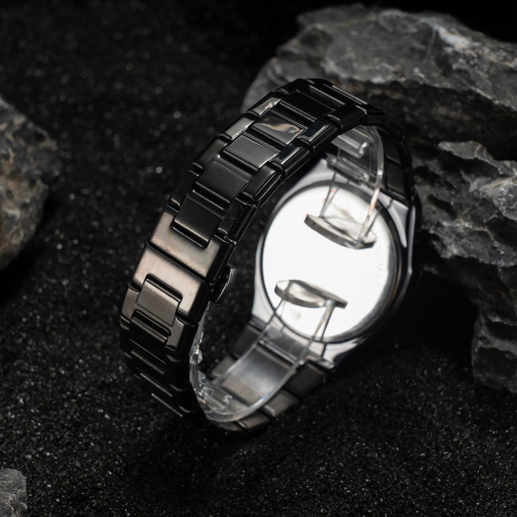Men's business casual quartz watch with steel bracelet showing slim 10mm case profile