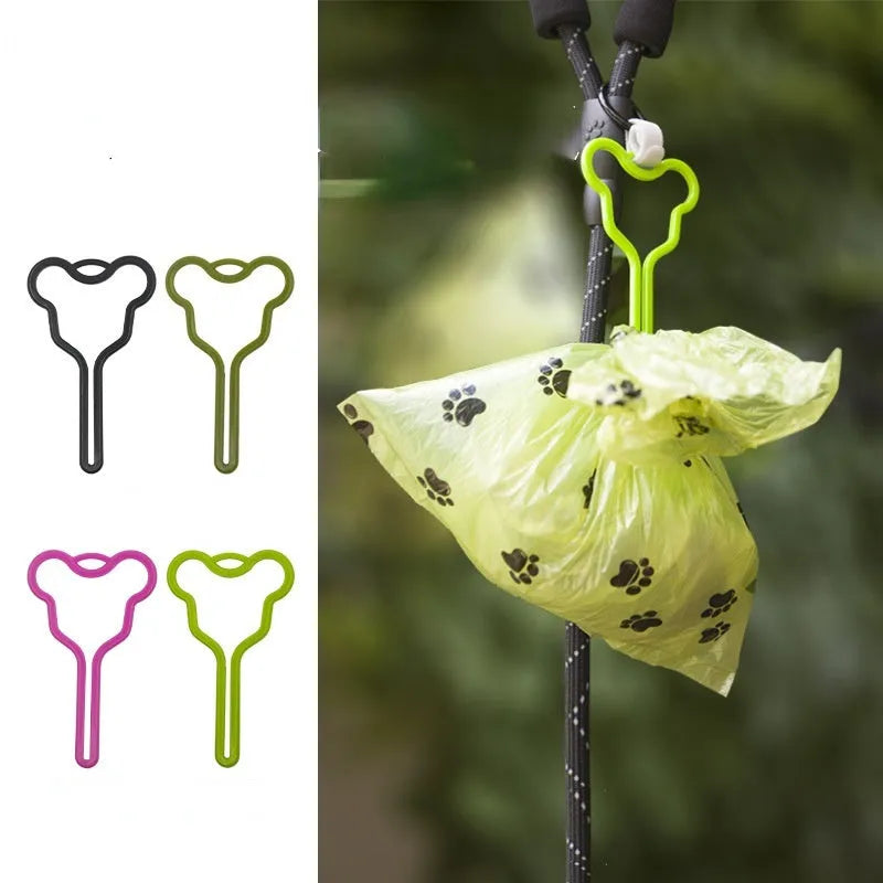 A hands-free dog poop bag holder with a clip and adjustable Velcro strap, shown in a random colour.
