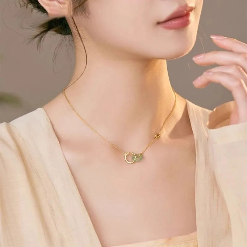 Handmade sterling silver necklace with a geometric bamboo joint peace buckle pendant on an adjustable chain.