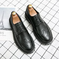 Men's black artificial PU brogue shoes with round toe and decorative perforations on a white background.