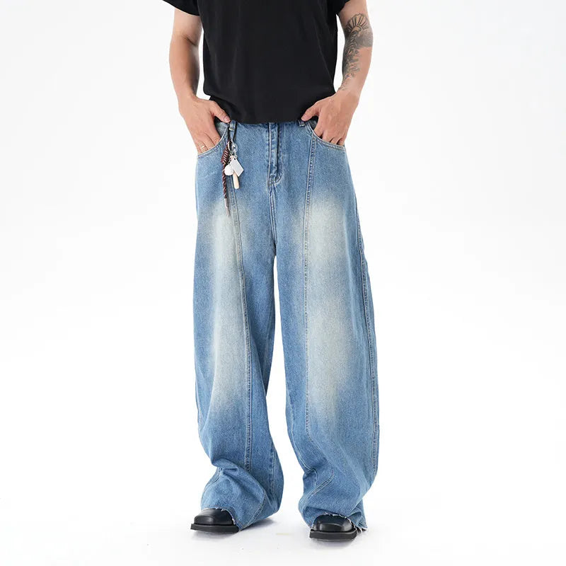 Cut washed vintage washed wide leg machete jeans in light blue denim fabric with zip fly