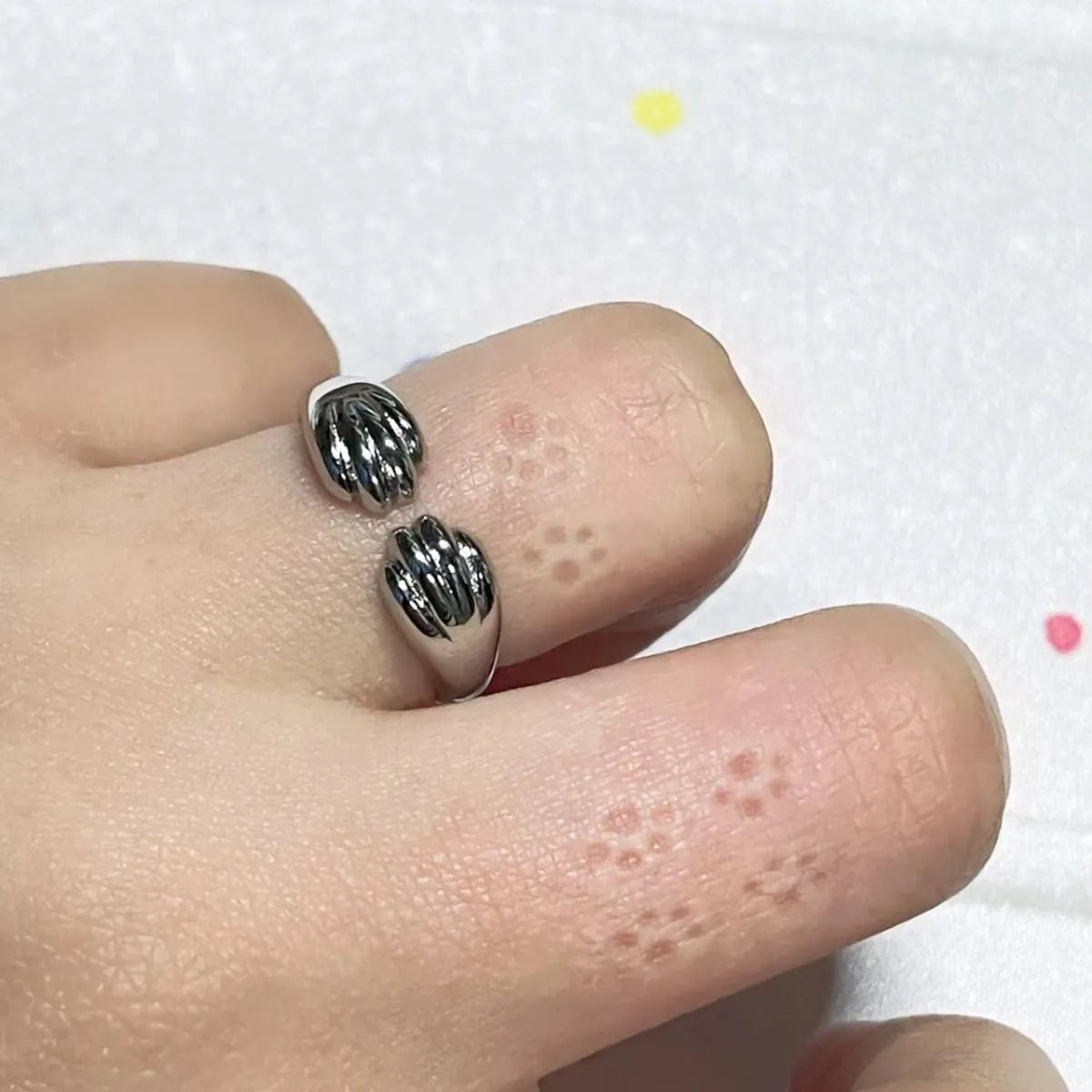 Cute kitten paw print ring in alloy with electroplated finish, unisex cartoon animal style
