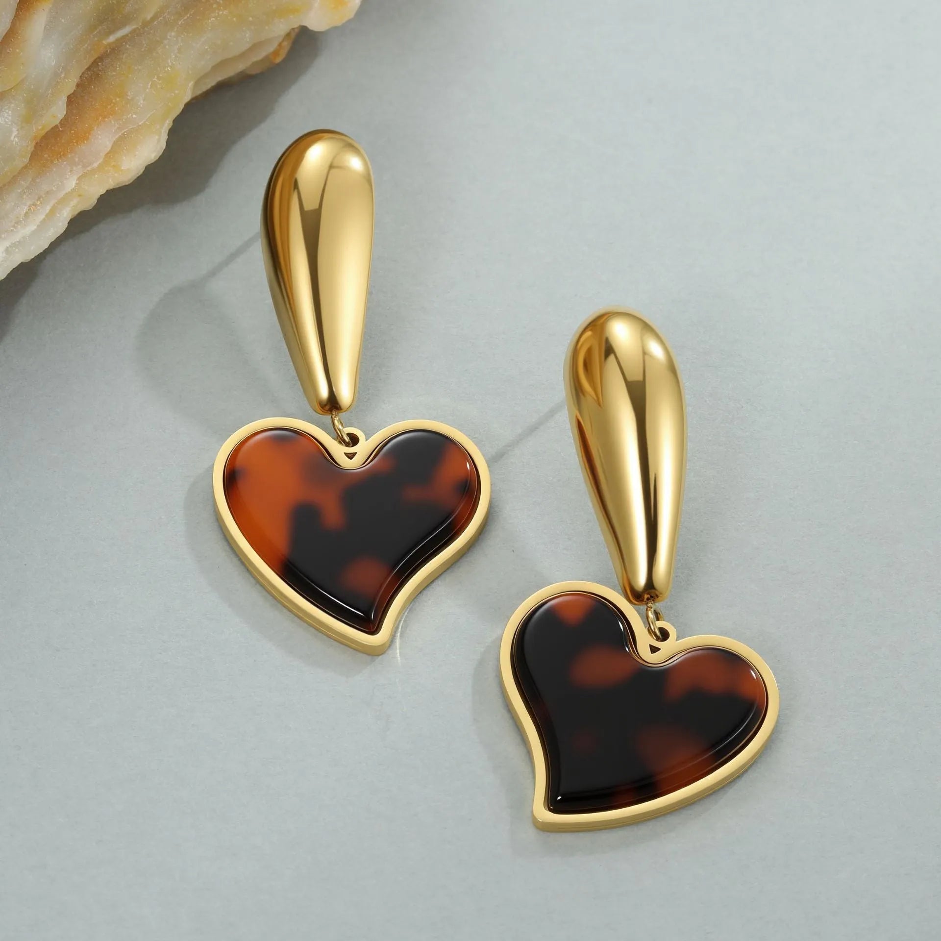 Tortoiseshell resin Hawksbill colour earrings in heart or flower shape made from 18K stainless steel.