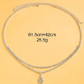Gold water drop pendant waist chain with tassel on a 115cm adjustable chain.