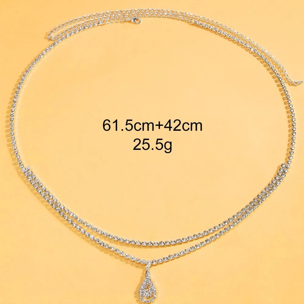 Gold water drop pendant waist chain with tassel on a 115cm adjustable chain.