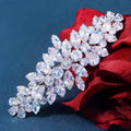 Women's inlaid zircon spring clip barrettes with electroplated leaf design on a neutral background
