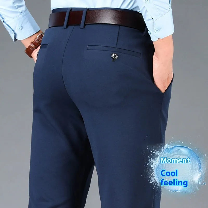 Men's straight-leg business casual trousers in elastic fabric, shown in black, available in waist sizes 29 to 52 inches.