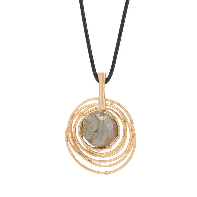 Vintage women's sweater chain necklace with large round geometric pendant in gold finish