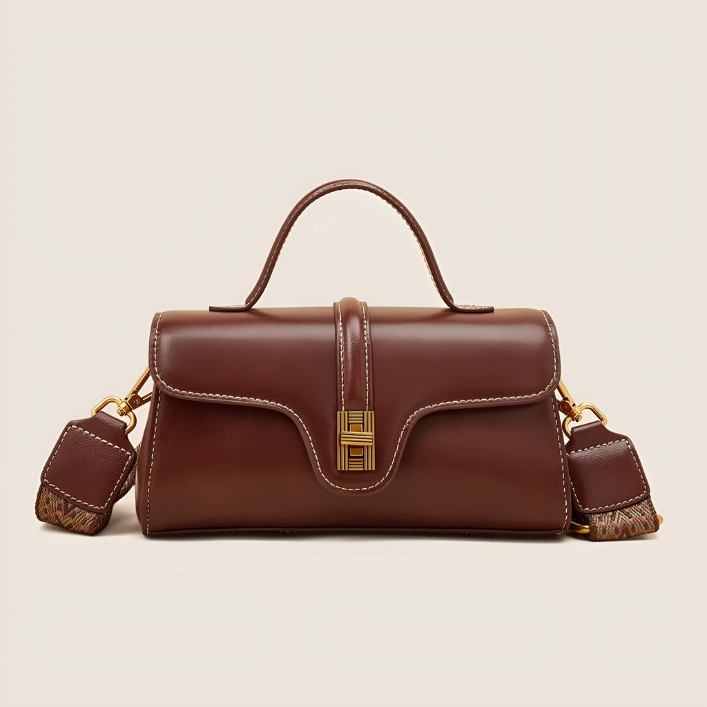Niche retro Cambridge messenger bag in brown cow leather with lock detail and clamshell opening