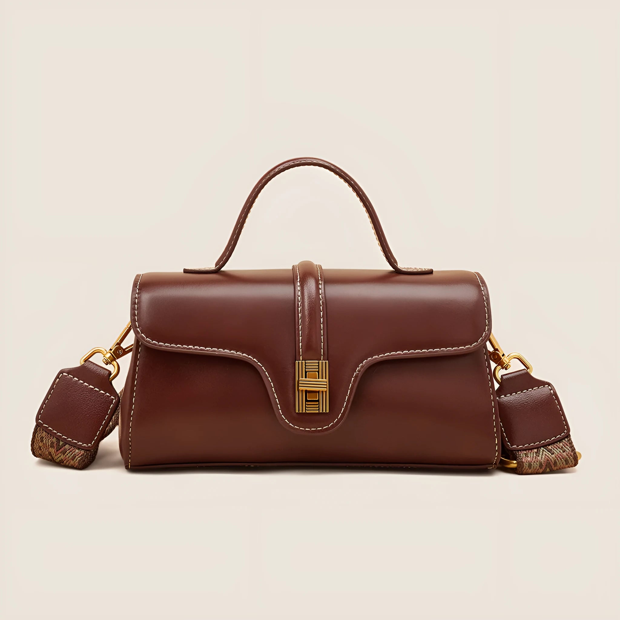 Niche retro Cambridge messenger bag in brown cow leather with lock detail and clamshell opening