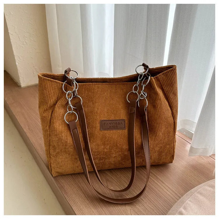 Corduroy women's tote handbag with one-shoulder strap and three-dimensional pocket in horizontal square shape