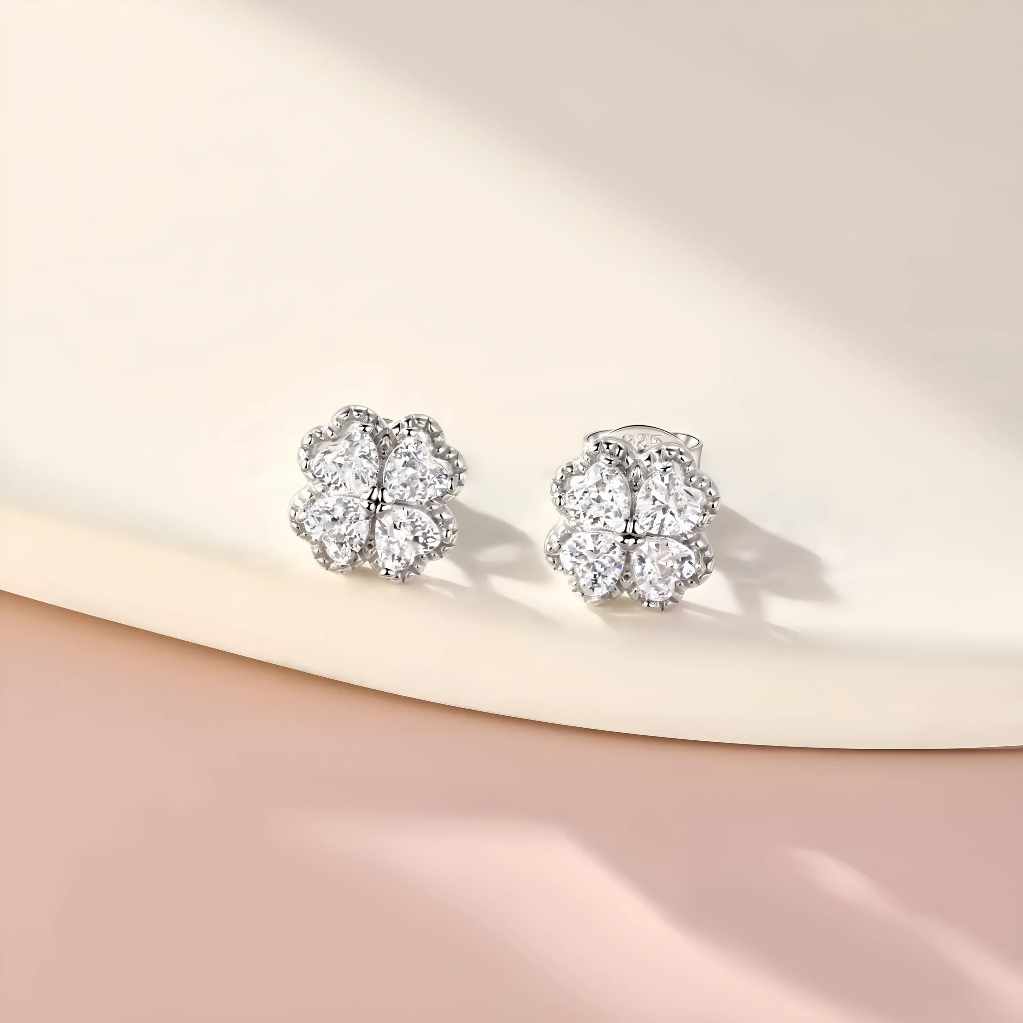 925 sterling silver heart-shaped four-leaf clover earrings with white gold colour and zircon stones.