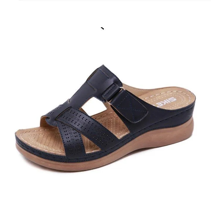 Women's black hollow peep toe wedge sandals with a Velcro strap closure
