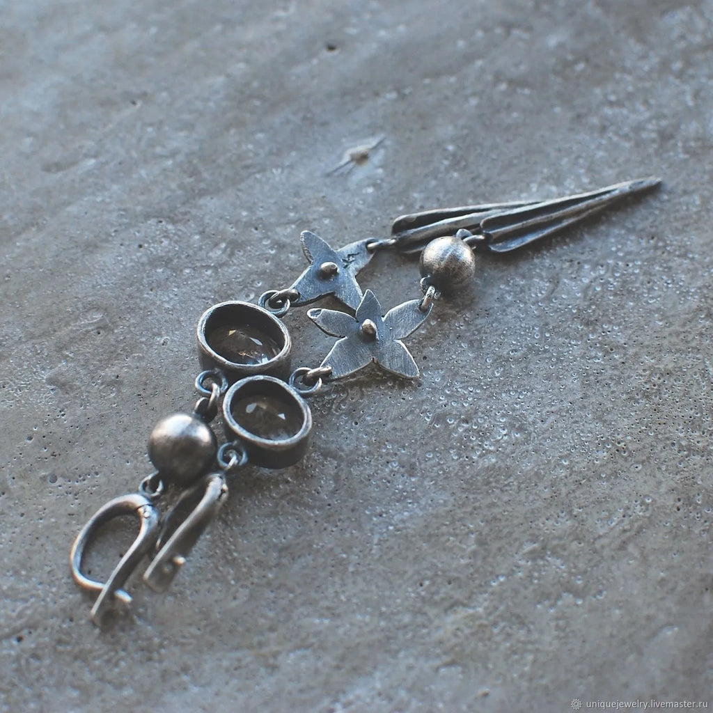 Geometric pendant drop earrings with antique silver finish and rhinestone detailing