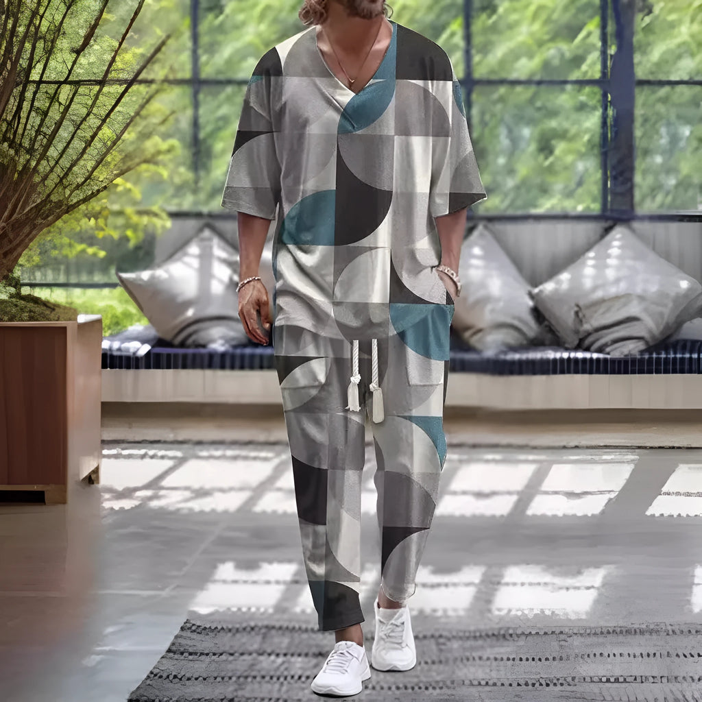 Woman wearing a light grey V-neck cropped sleeve jacket and matching trousers from a two-piece polyester suit.