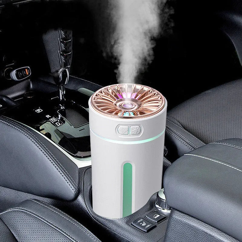 Black wireless portable humidifier with colourful lights beside car cup holder