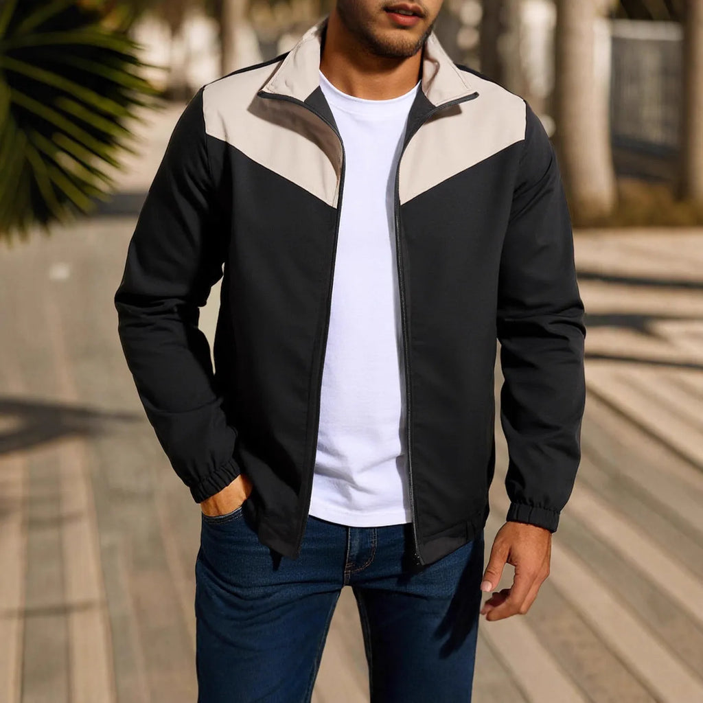 Men's green windproof polyester jacket with high collar and zip, showing raglan sleeve design.
