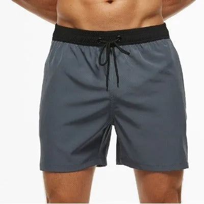Men's blue running shorts with zipper pocket and drawstring waist detail for fitness activities