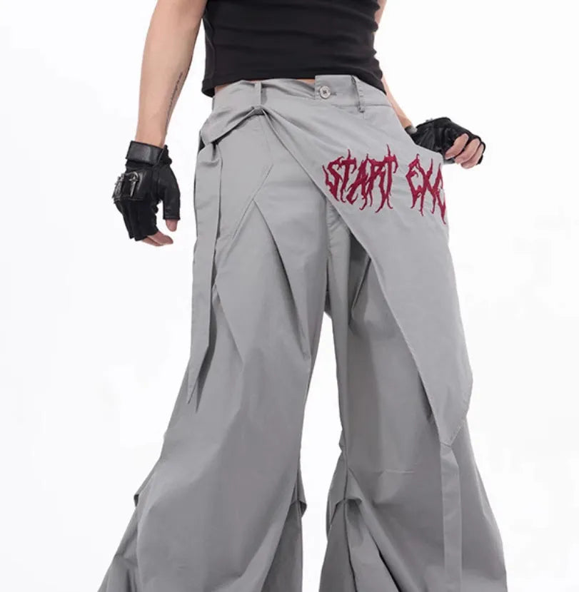 Boy modelling black Korean-style wide-leg summer trousers in a casual setting.