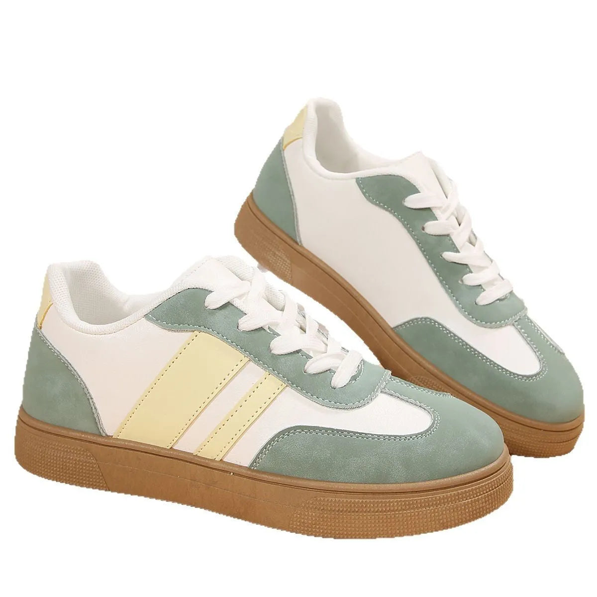 Green women's low-top retro sports shoes with cross straps and a flat rubber sole.