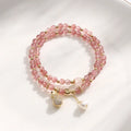 A geometric wallet bracelet for women made from pink strawberry quartz crystal.